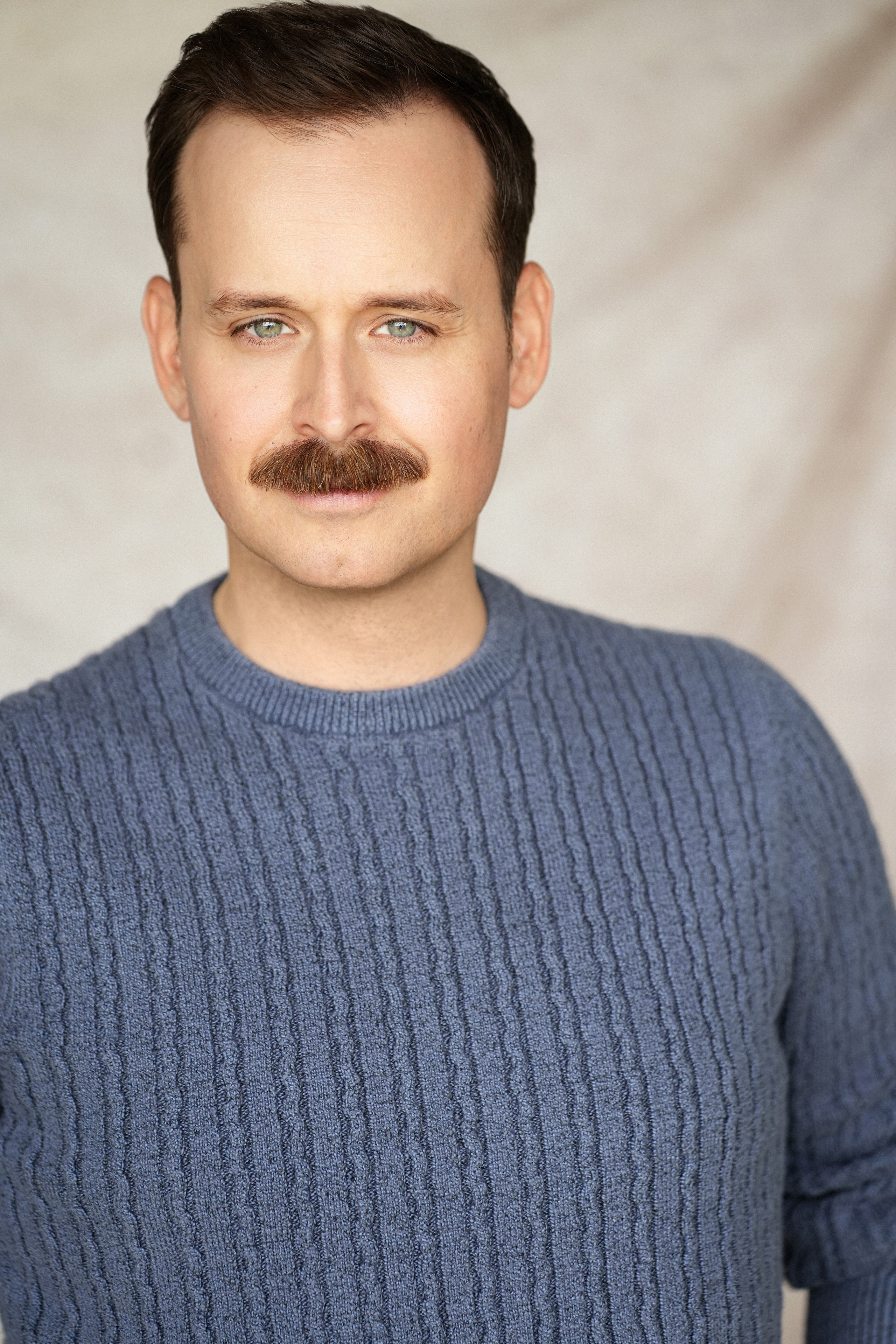 Erik Gow — blue sweater